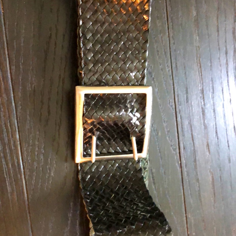 Black braided belt with silver buckle.